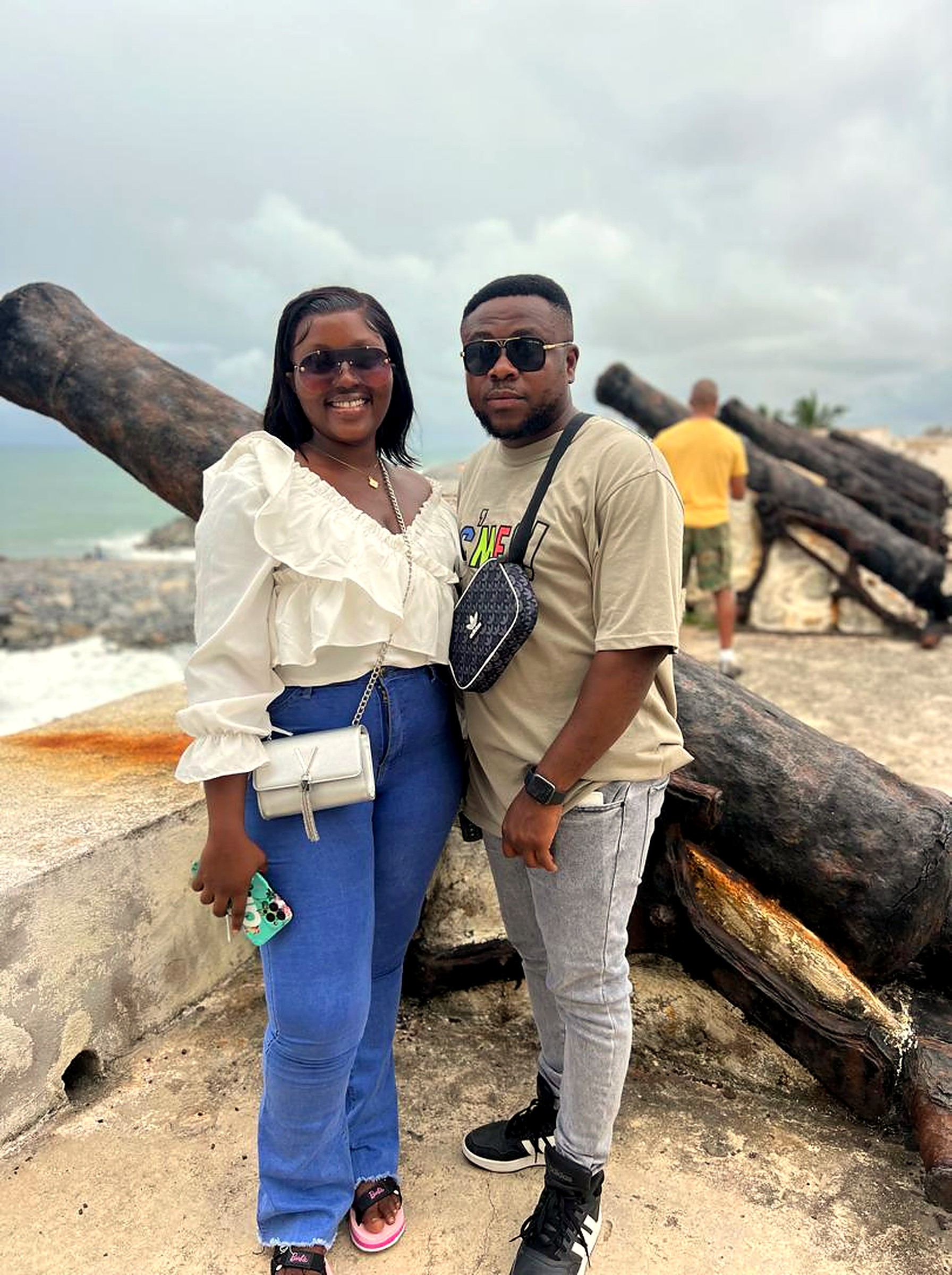 Eddy and Kessewa smiling together on the coast